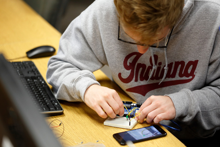 Student working on an electrical board